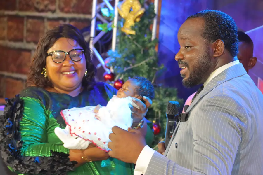 A dedication moment during a Worldlight service