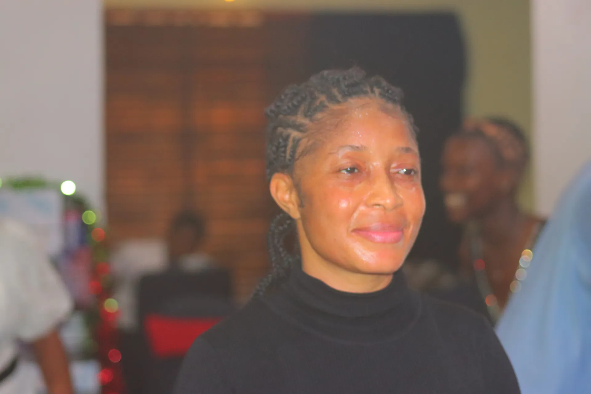 A member of the congregation smiling softly