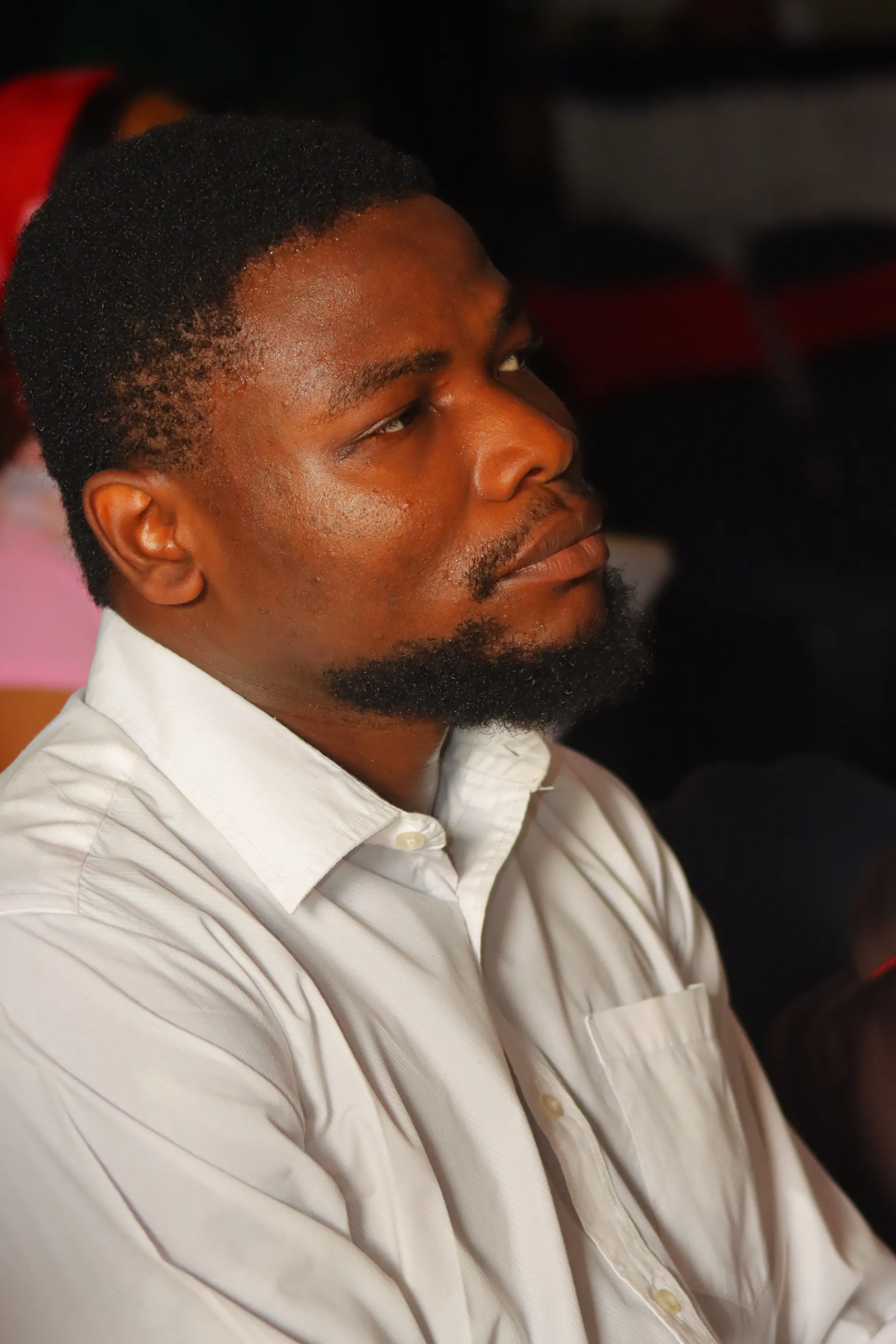 A member in quiet reflection during worship