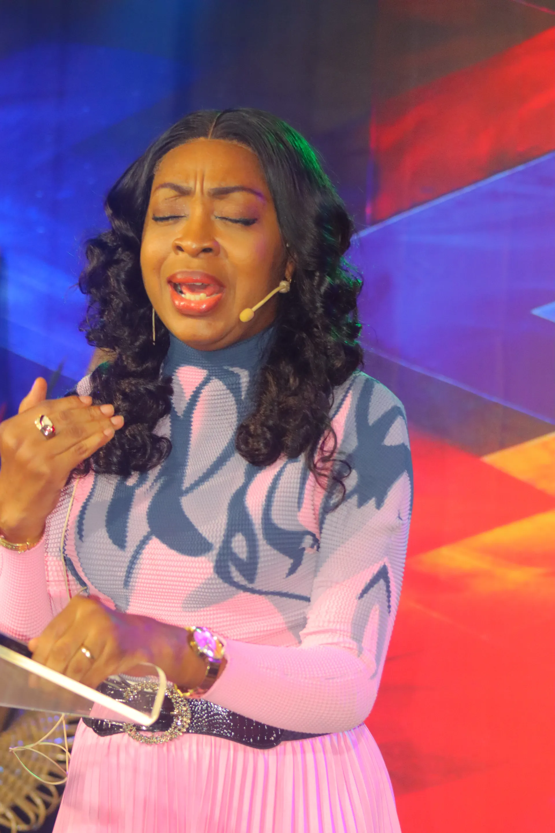 A worshipper singing wholeheartedly during service